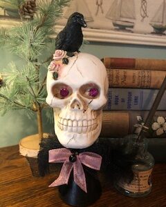 Skull with glitter eyes on a stand